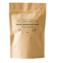 Brown packaging of Sol Nut Company organic roasted and salted pecans on a white background